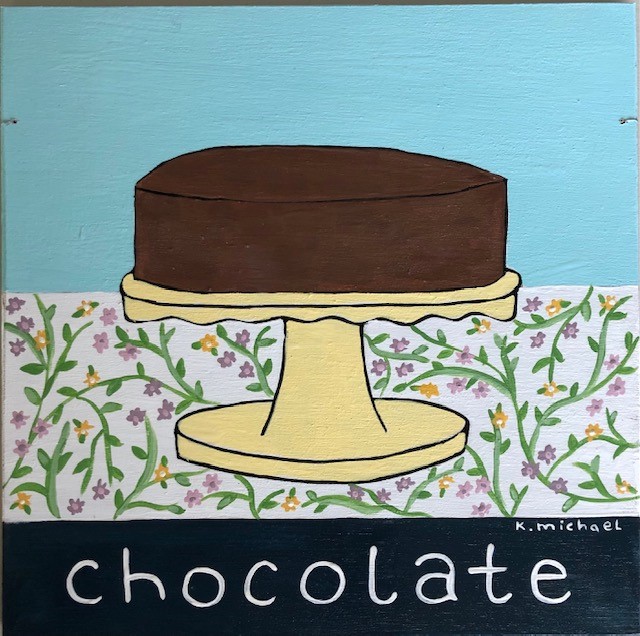 A large chocolate cake sitting on top of a table

Description automatically generated